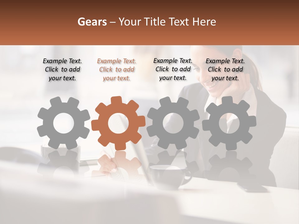 A Woman Sitting At A Table Using A Laptop Computer PowerPoint Template