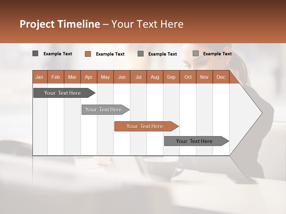 A Woman Sitting At A Table Using A Laptop Computer PowerPoint Template