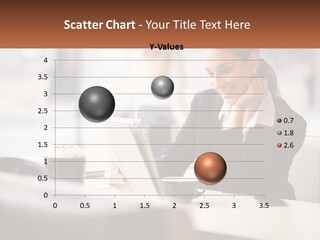 A Woman Sitting At A Table Using A Laptop Computer PowerPoint Template
