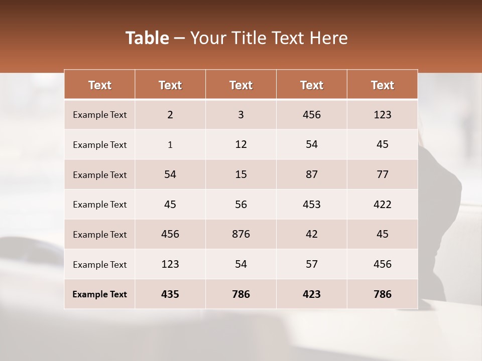 A Woman Sitting At A Table Using A Laptop Computer PowerPoint Template