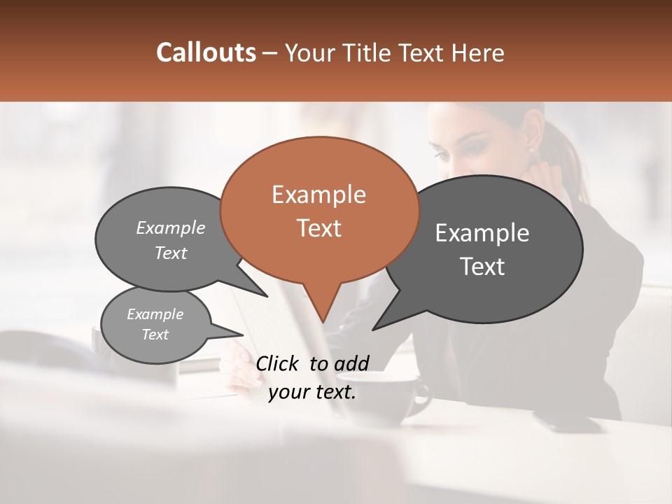 A Woman Sitting At A Table Using A Laptop Computer PowerPoint Template