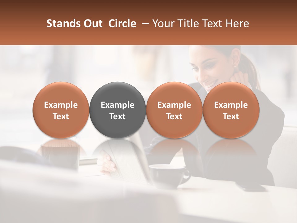 A Woman Sitting At A Table Using A Laptop Computer PowerPoint Template