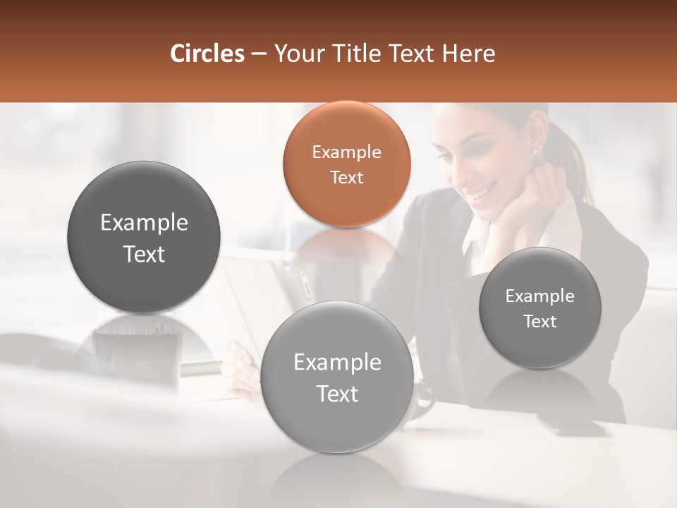 A Woman Sitting At A Table Using A Laptop Computer PowerPoint Template