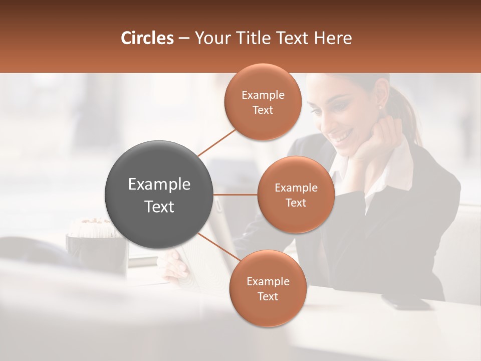 A Woman Sitting At A Table Using A Laptop Computer PowerPoint Template