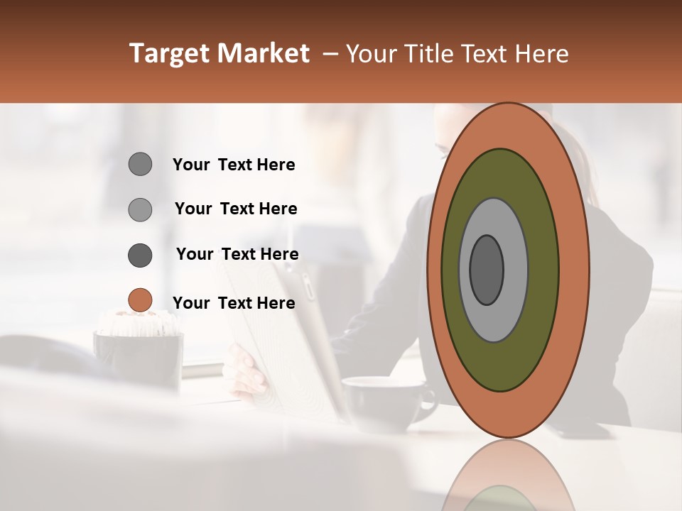 A Woman Sitting At A Table Using A Laptop Computer PowerPoint Template