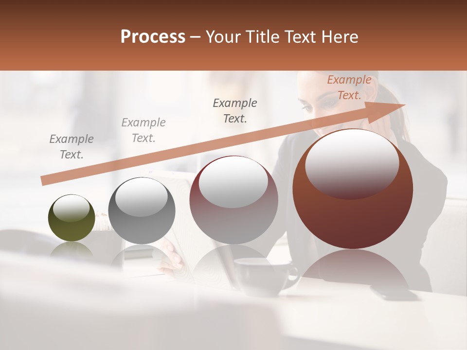 A Woman Sitting At A Table Using A Laptop Computer PowerPoint Template