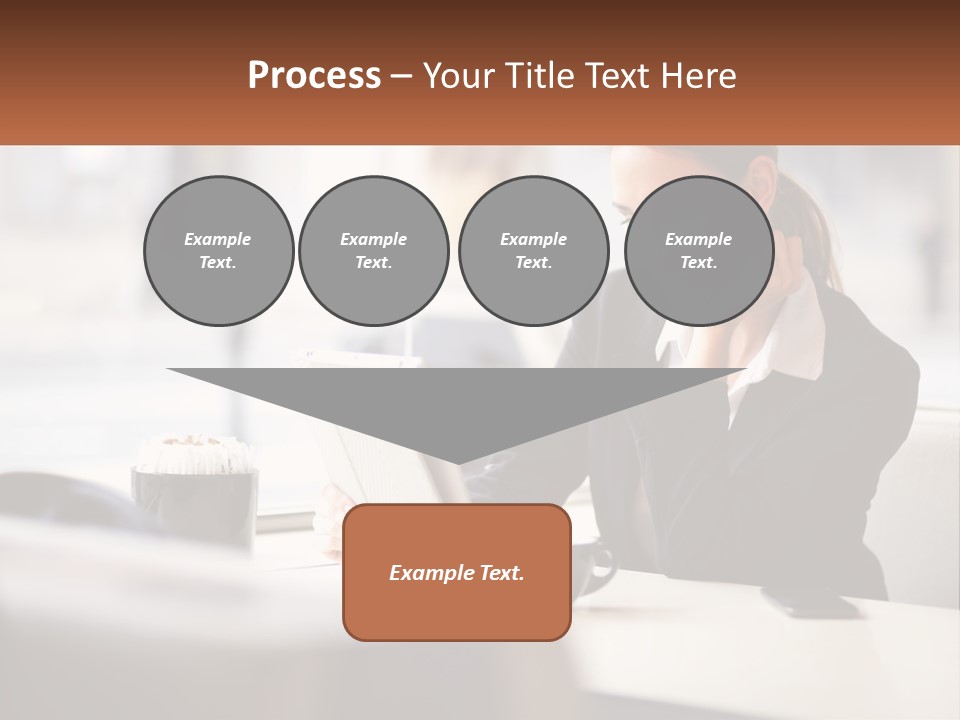 A Woman Sitting At A Table Using A Laptop Computer PowerPoint Template