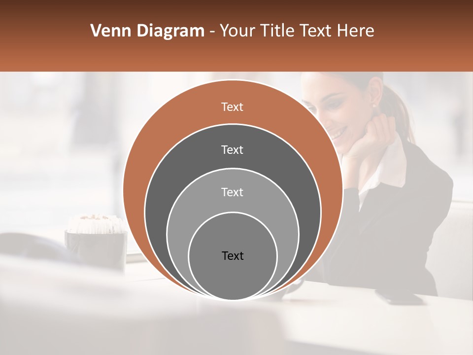 A Woman Sitting At A Table Using A Laptop Computer PowerPoint Template