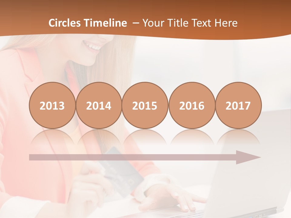 A Woman Holding A Credit Card And Looking At A Laptop PowerPoint Template