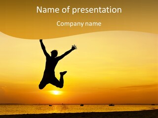 A Man Jumping Into The Air On A Beach At Sunset PowerPoint Template