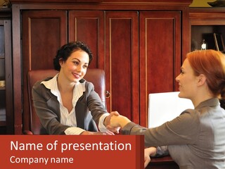 Two Women Shaking Hands In An Office Setting PowerPoint Template