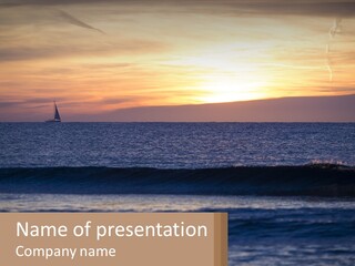 A Sailboat In The Ocean At Sunset PowerPoint Template