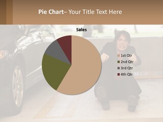 A Woman Sitting On The Ground In Front Of A Car PowerPoint Template