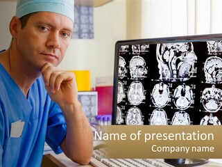 A Man In Scrubs Sitting In Front Of A Computer PowerPoint Template