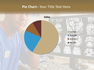 A Man In Scrubs Sitting In Front Of A Computer PowerPoint Template