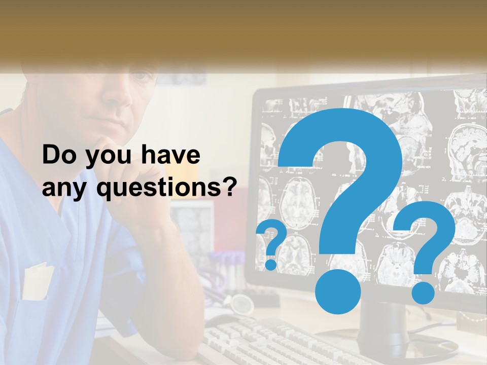 A Man In Scrubs Sitting In Front Of A Computer PowerPoint Template