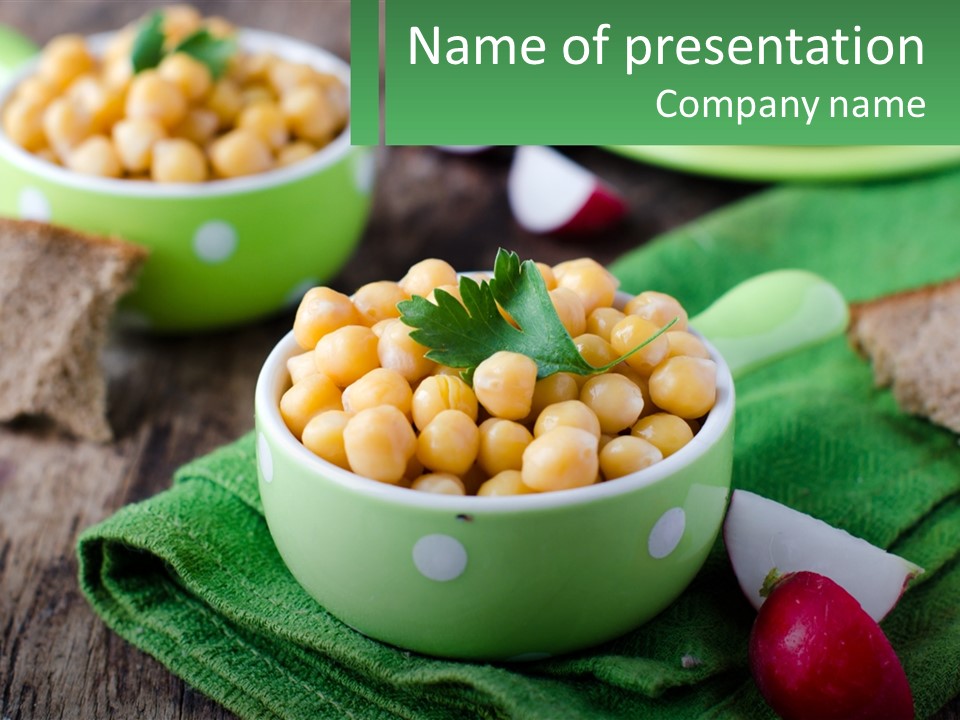 A Green Bowl Filled With Corn On Top Of A Table PowerPoint Template
