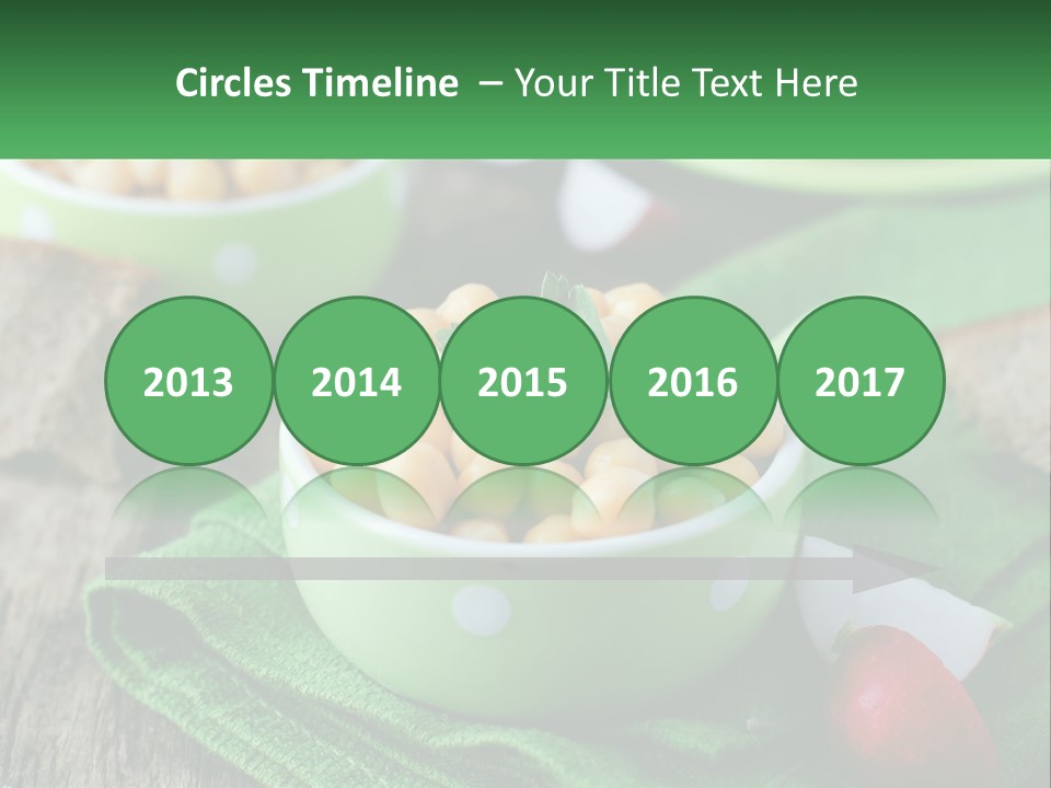 A Green Bowl Filled With Corn On Top Of A Table PowerPoint Template