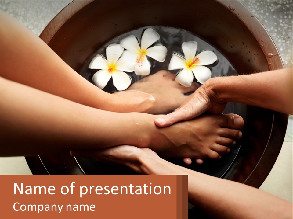 A Group Of People Holding Hands Over A Bowl Of Water With Flowers PowerPoint Template