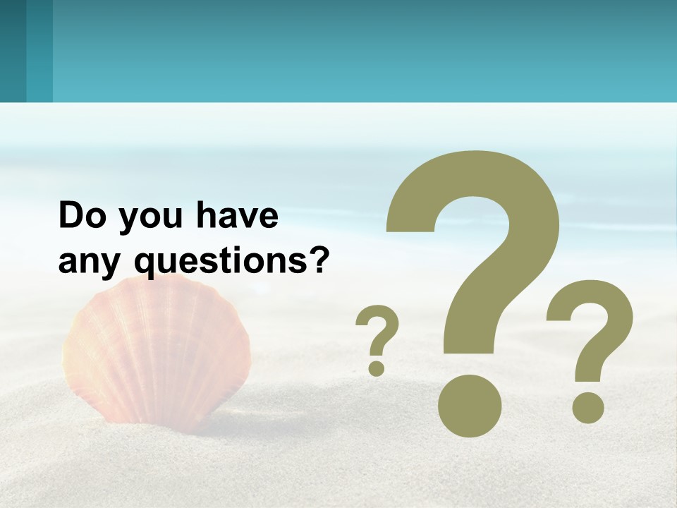 A Seashell On A Sandy Beach With The Ocean In The Background PowerPoint Template