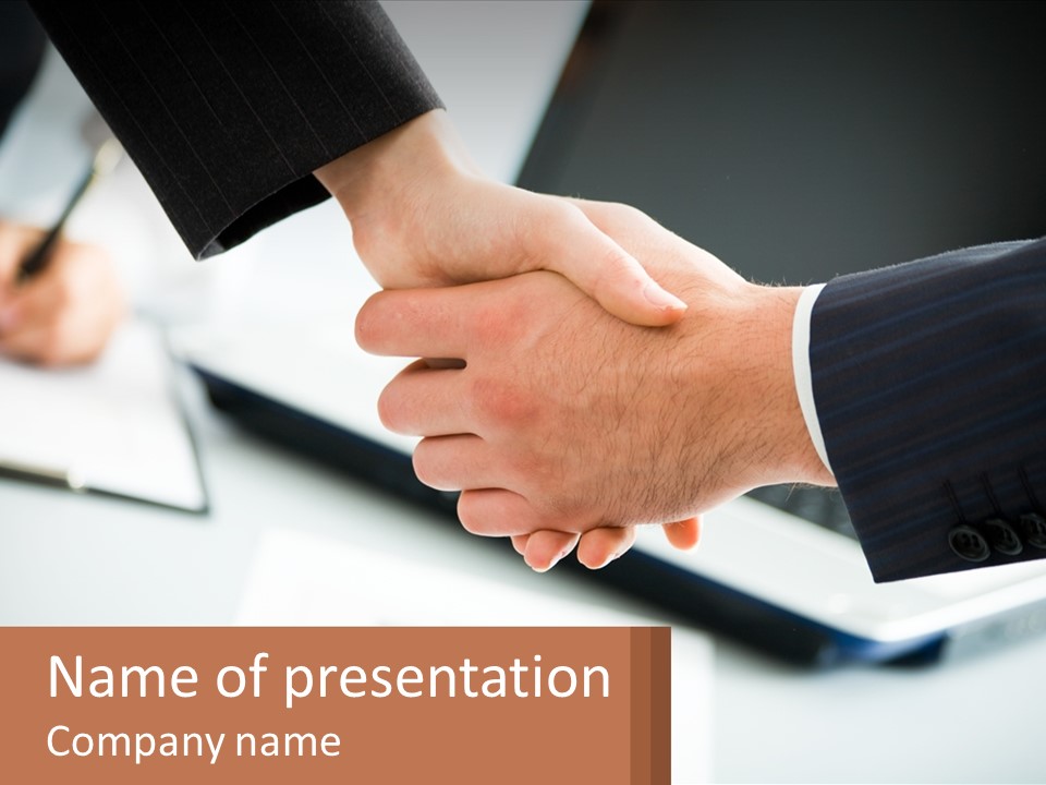 Two People Shaking Hands Over A Laptop Computer PowerPoint Template