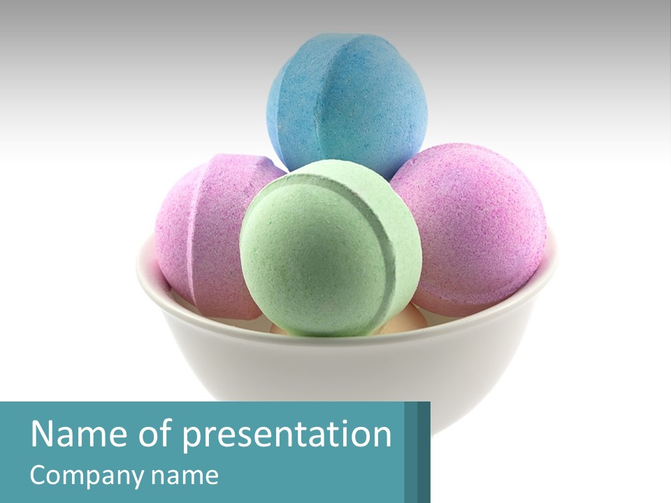 A Bowl Filled With Bath Bombs On Top Of A Table PowerPoint Template