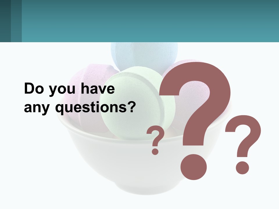 A Bowl Filled With Bath Bombs On Top Of A Table PowerPoint Template