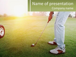 A Man Putting A Golf Ball On The Green PowerPoint Template