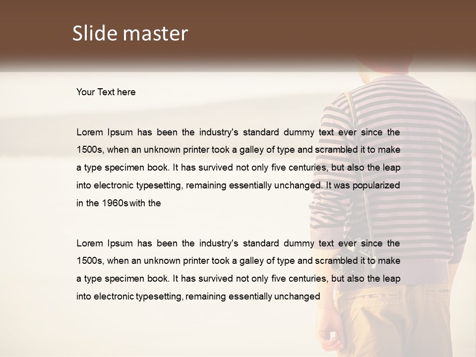 A Man Standing On A Beach With A Camera PowerPoint Template