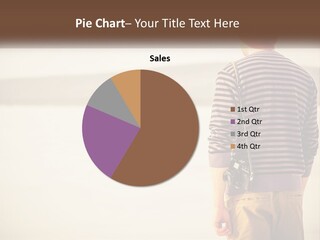 A Man Standing On A Beach With A Camera PowerPoint Template