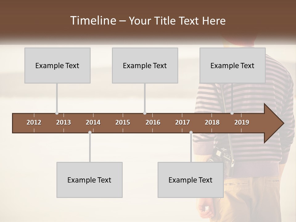 A Man Standing On A Beach With A Camera PowerPoint Template