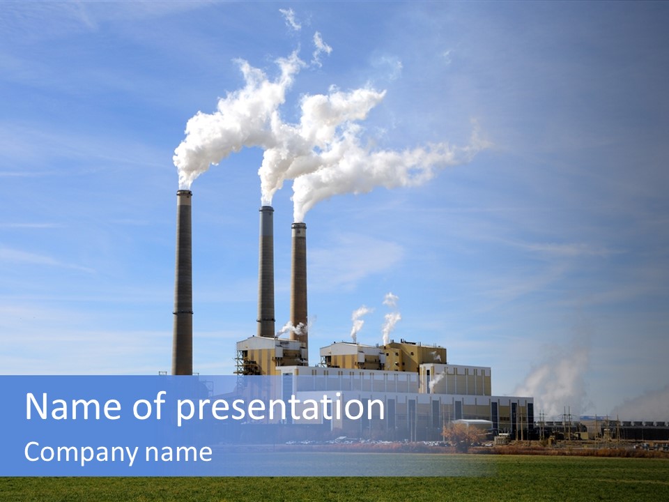 A Power Plant With Smoke Coming Out Of It PowerPoint Template