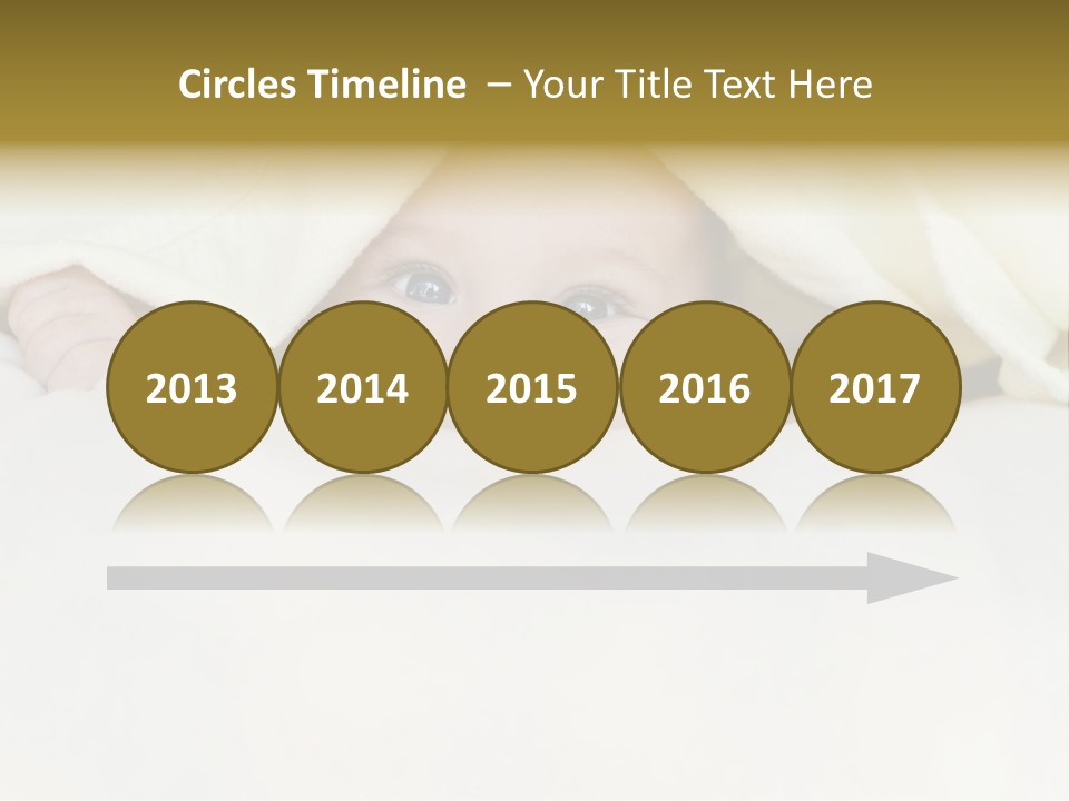 A Baby Peeking Out From Under A Blanket PowerPoint Template