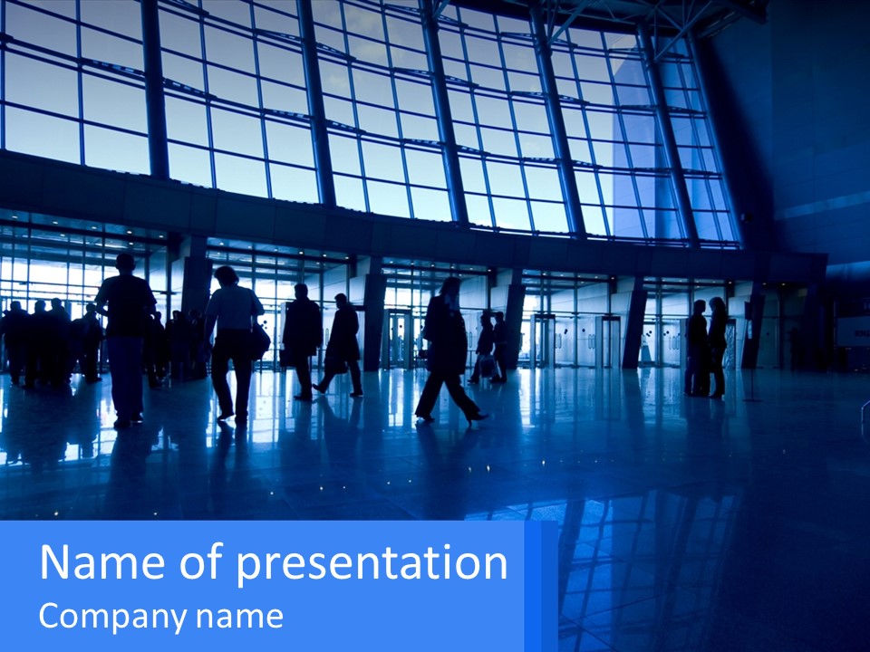 A Group Of People Walking Through An Airport PowerPoint Template