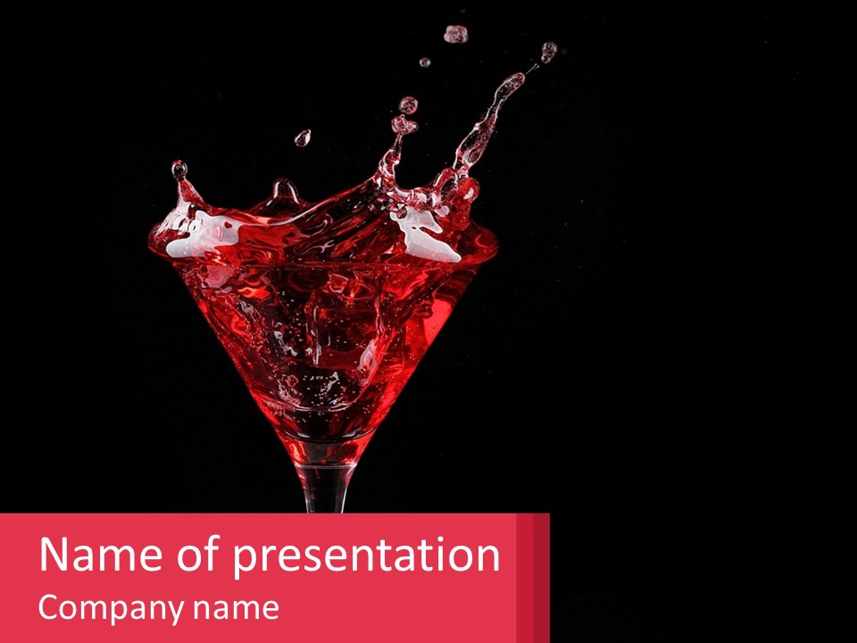 A Red Drink Splashing Into A Martini Glass PowerPoint Template