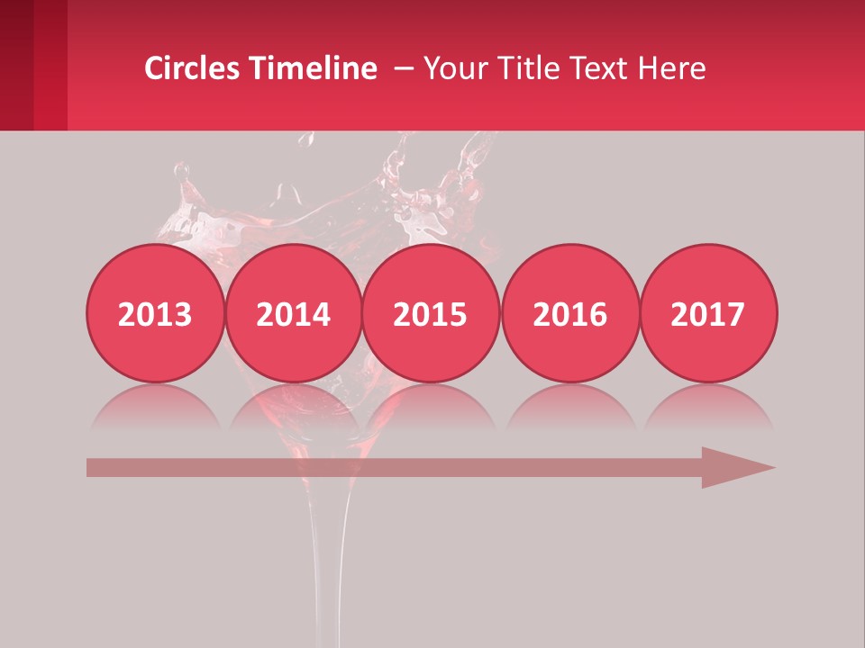 A Red Drink Splashing Into A Martini Glass PowerPoint Template