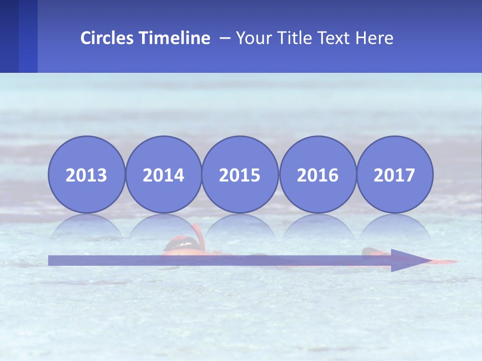 A Person Swimming In The Ocean With A Blue Background PowerPoint Template