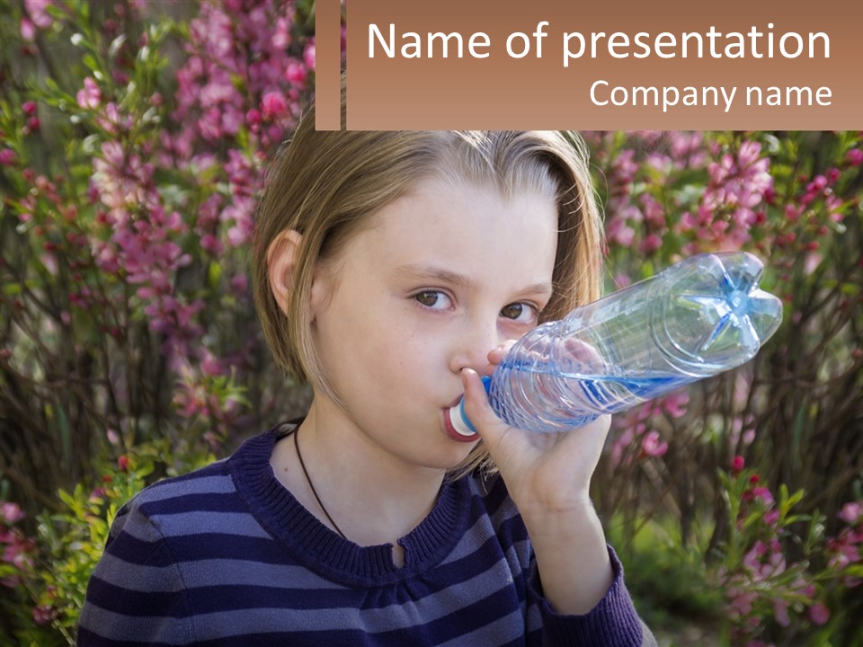 A Young Girl Drinking Water From A Water Bottle PowerPoint Template