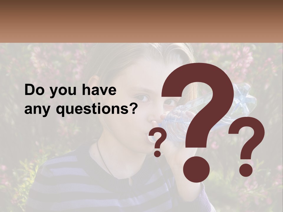 A Young Girl Drinking Water From A Water Bottle PowerPoint Template