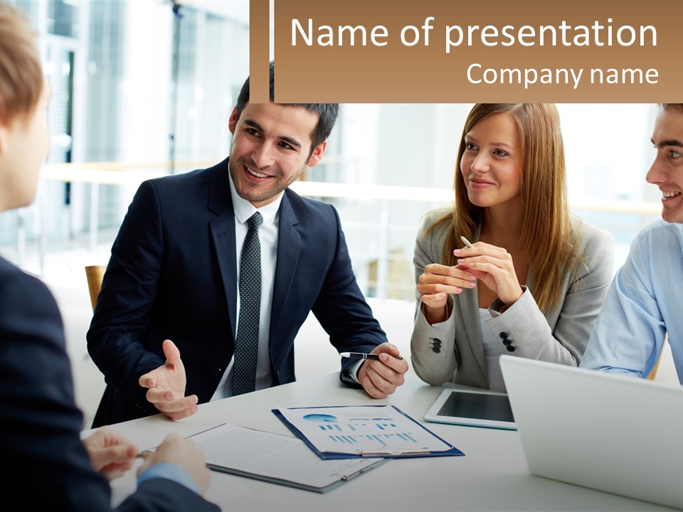 A Group Of People Sitting Around A Table Talking PowerPoint Template