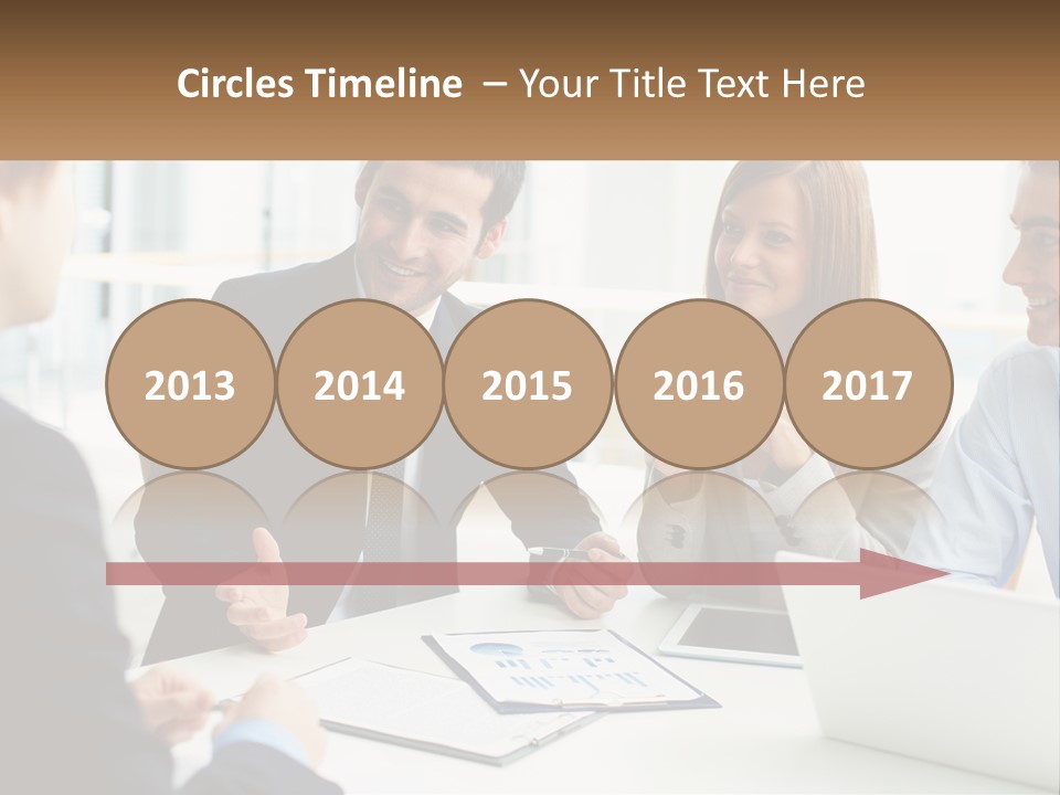 A Group Of People Sitting Around A Table Talking PowerPoint Template