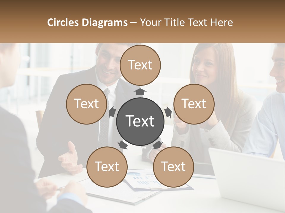 A Group Of People Sitting Around A Table Talking PowerPoint Template