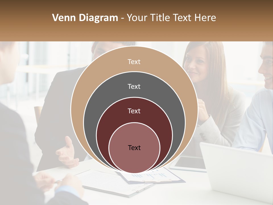 A Group Of People Sitting Around A Table Talking PowerPoint Template