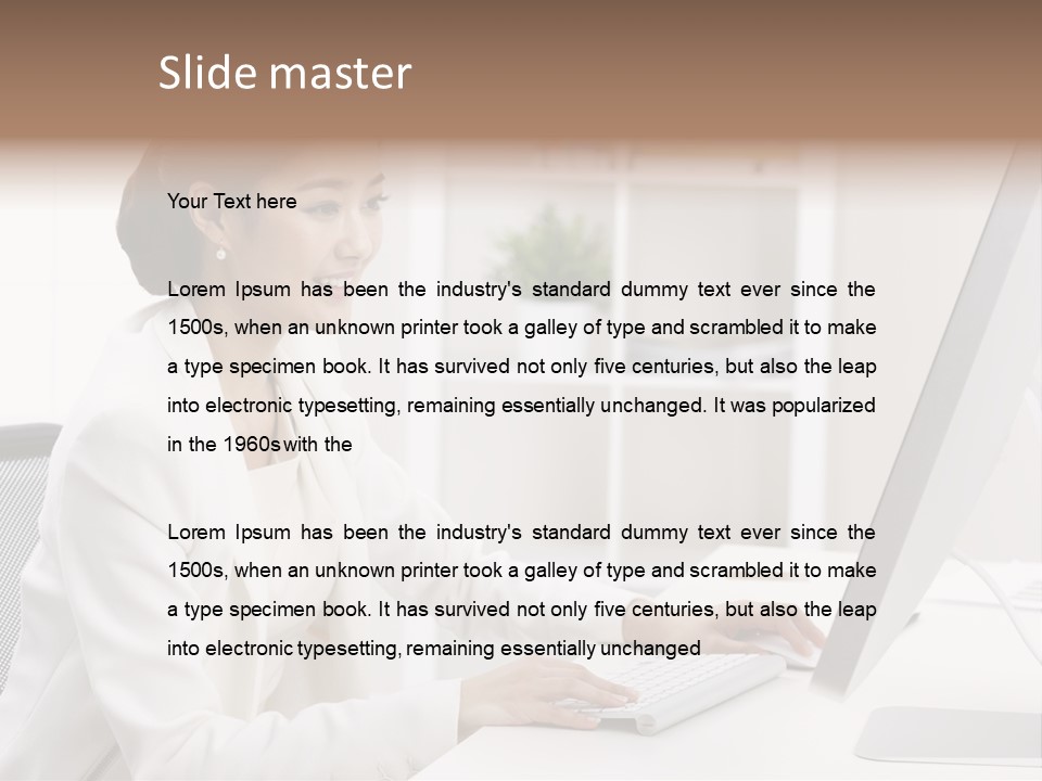 A Woman Sitting At A Desk Using A Computer PowerPoint Template