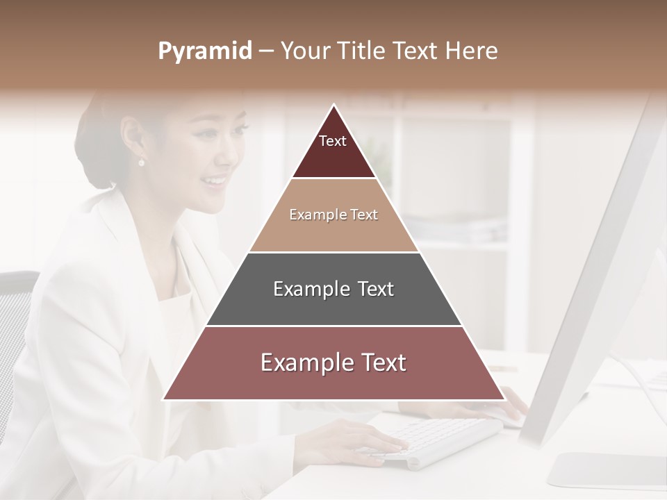 A Woman Sitting At A Desk Using A Computer PowerPoint Template