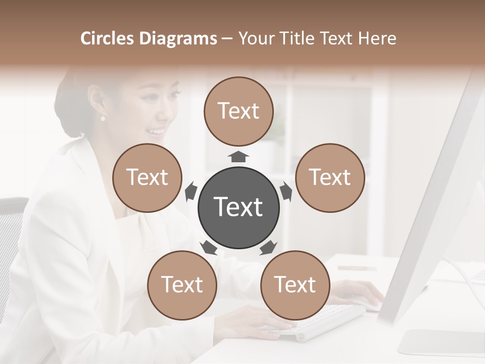 A Woman Sitting At A Desk Using A Computer PowerPoint Template