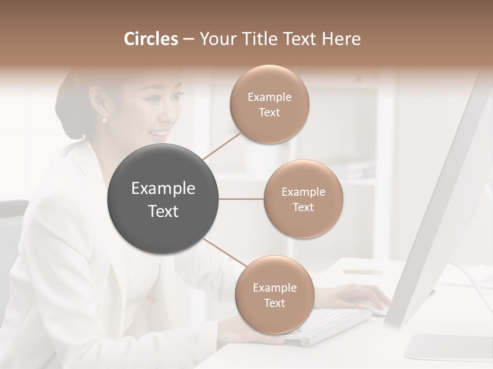 A Woman Sitting At A Desk Using A Computer PowerPoint Template