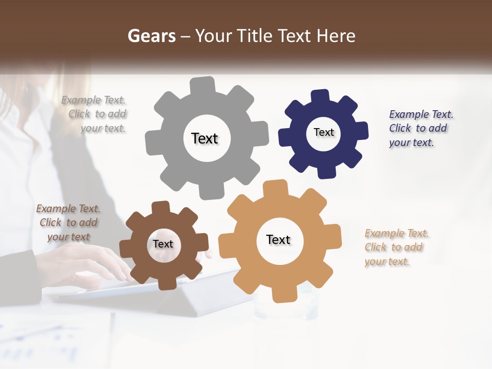 A Woman Sitting At A Table Using A Tablet Computer PowerPoint Template