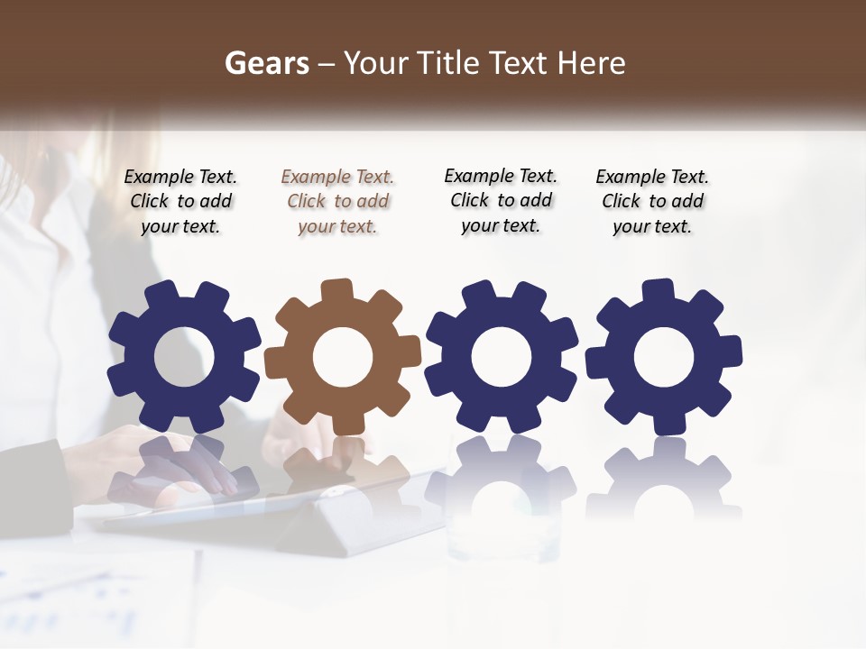 A Woman Sitting At A Table Using A Tablet Computer PowerPoint Template