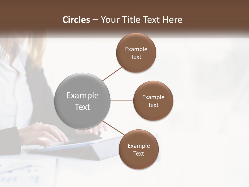 A Woman Sitting At A Table Using A Tablet Computer PowerPoint Template